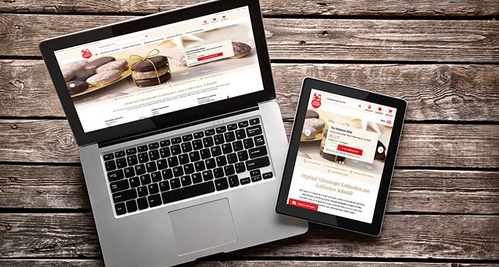 Laptop und Tablet zeigen die Webseite von Lebkuchen-Schmidt